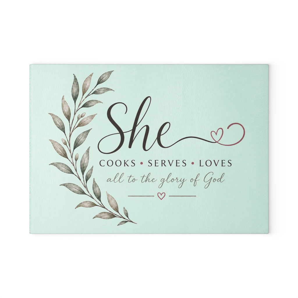 Decorative sign with text 'She cooks, serves, loves all to the glory of God' on a light green background | FaithfulFindsNZ