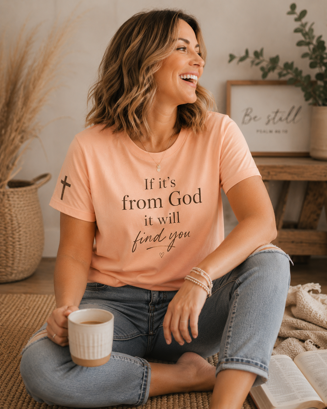 Airlume cotton tee with 'If It's From God It Will Find You' faith script and small sleeve cross accent detail.