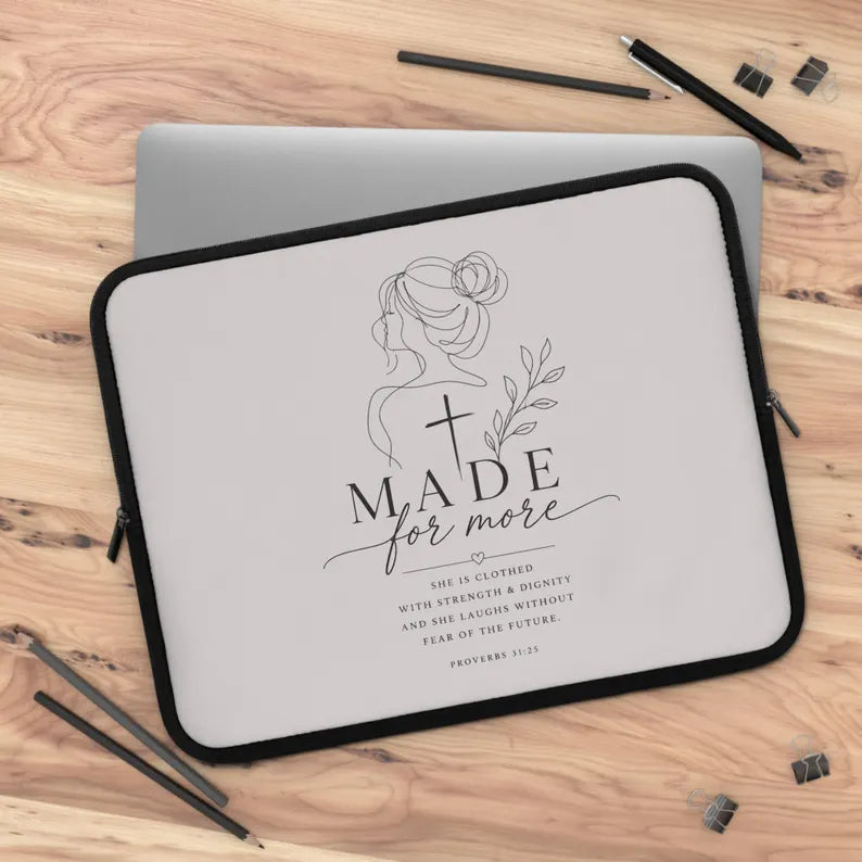 Laptop sleeve with motivational quote on a wooden surface | FaithfulFindsNZ
